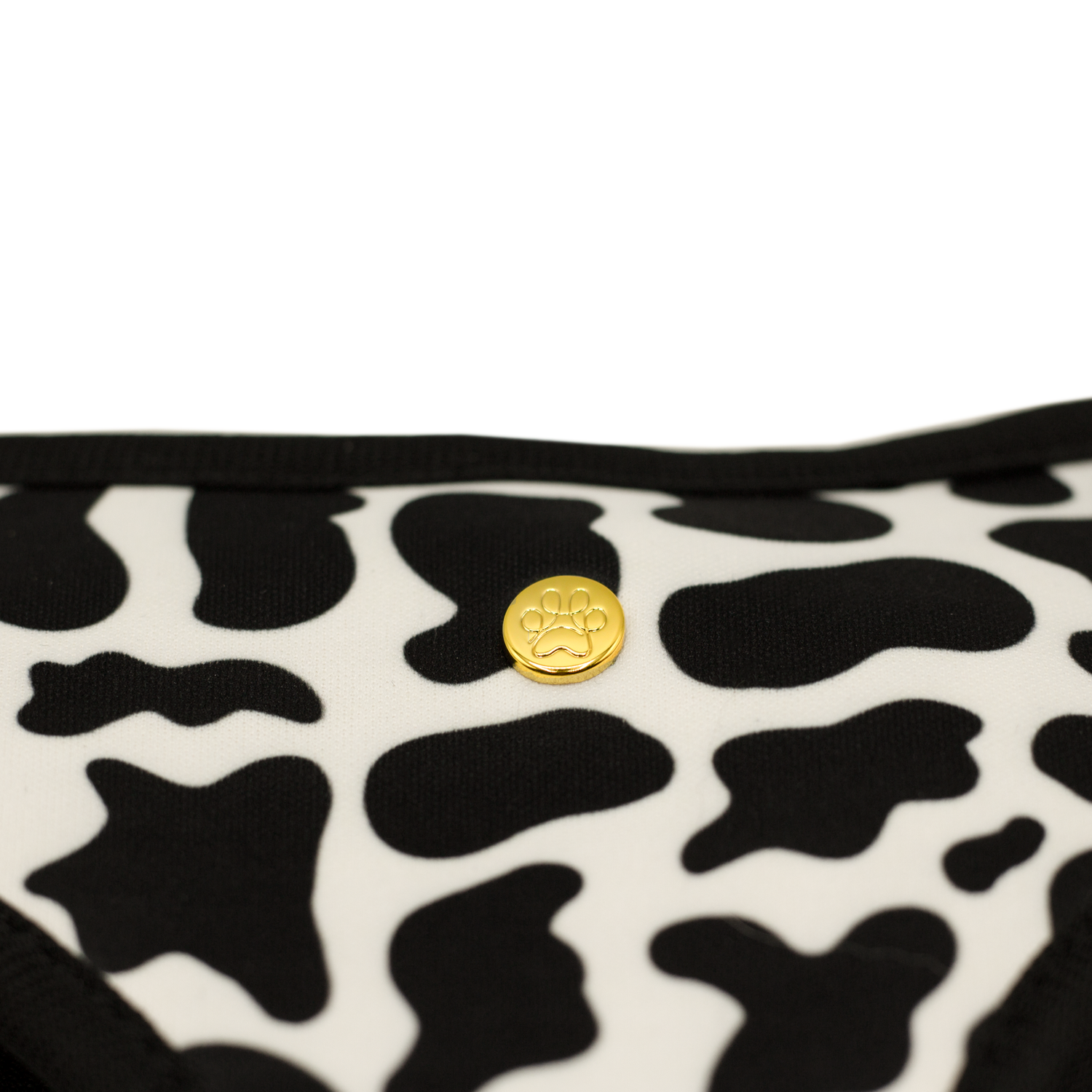 Pata Paw moo reversible harness showing a close-up of its golden paw and pattern.