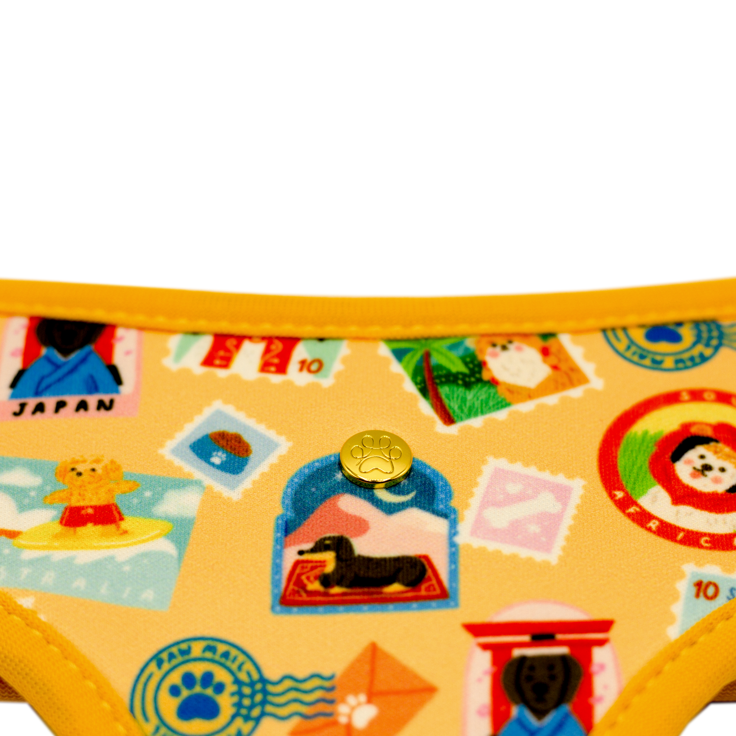 Pata Paw traveling pups  reversible harness showing a close-up of its golden paw.