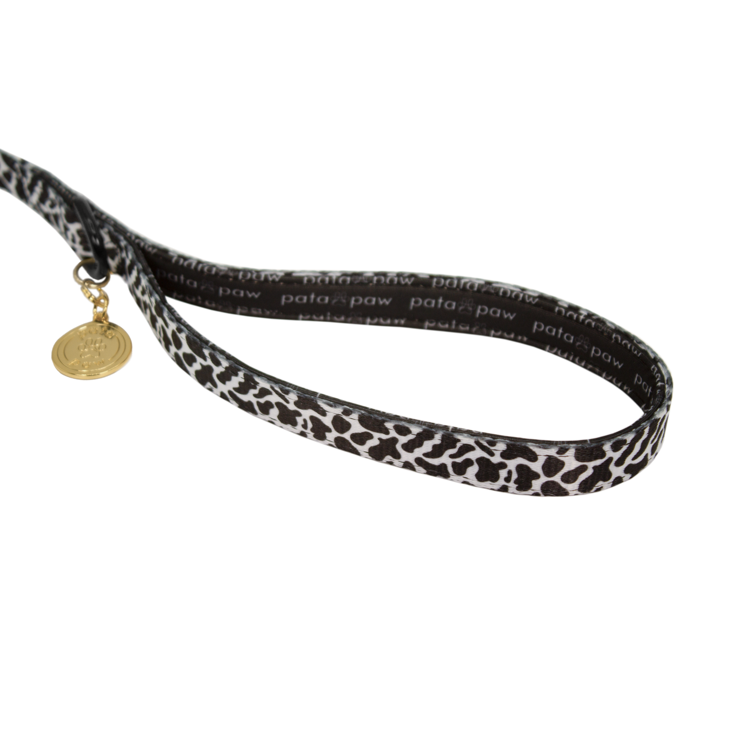 pata paw moo showing signature handle, metallic ring to attach a poop bag holder and golden paw medal