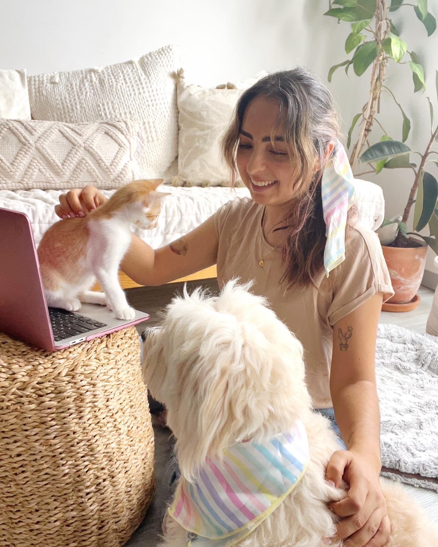 Ana (dog mom) and Maca (her best friend) wearing Pata Paw's matching bandanas. Ana wears size L rainbow stripes bandana and Maca wears size M.