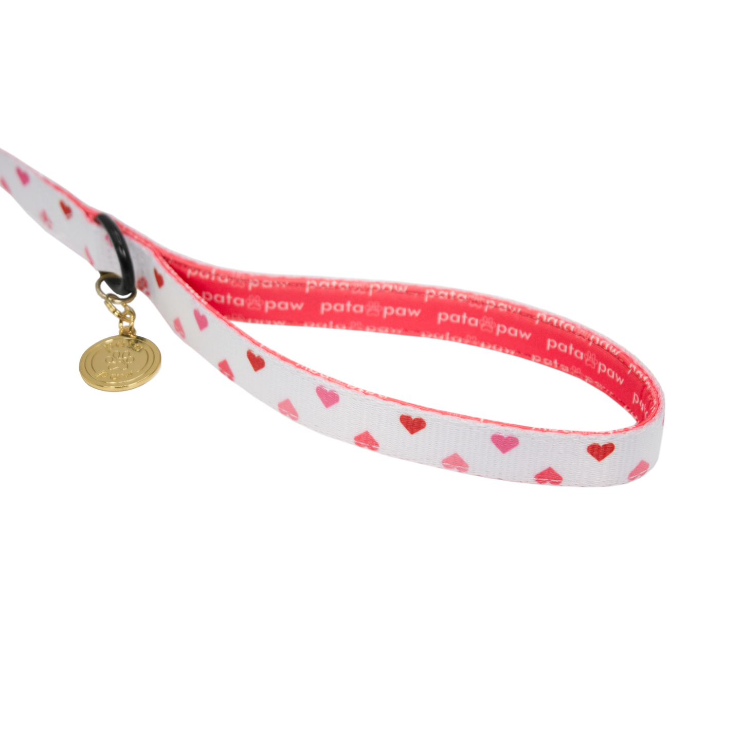 pata paw blush hearts leash showing signature handle, metallic ring to attach a poop bag holder and golden paw medal